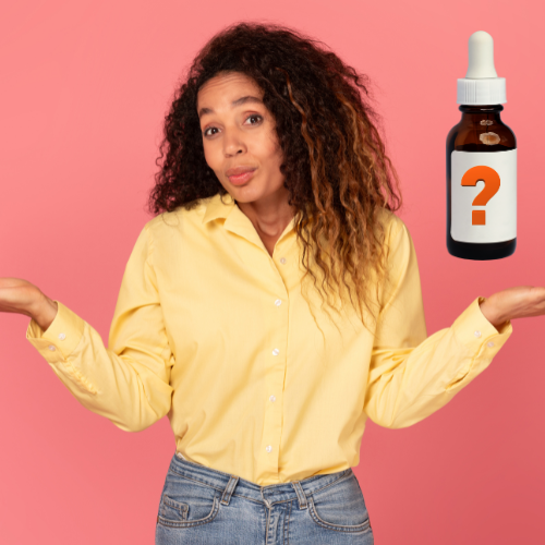 A young woman standing and thoughtfully choosing the best face serum in Pakistan for 2025.
